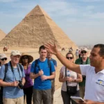 Expert Daily Sun Travel tour guide explaining the history of the Great Pyramids of Giza to a group of tourists.
