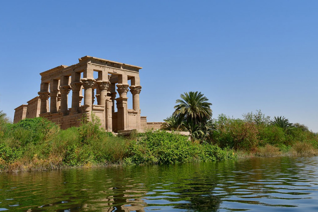 Motorboat approach to Philae Temple during an Aswan private tour
