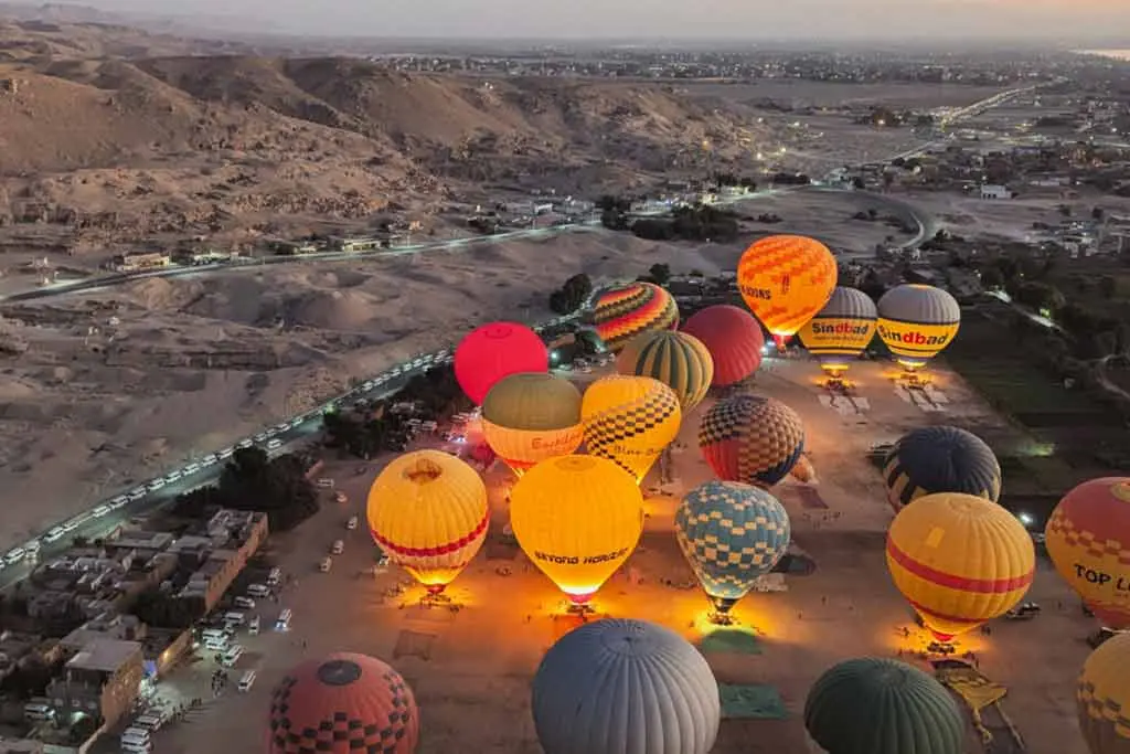 Sunrise hot air balloon flying over the Luxor West Bank